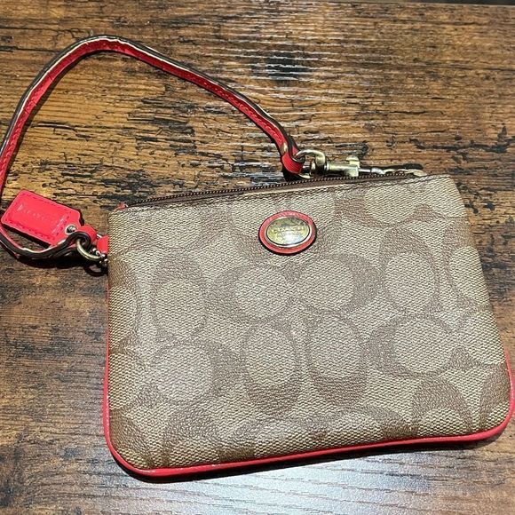 Coach Handbags - Coach wristlet with coral pink accents